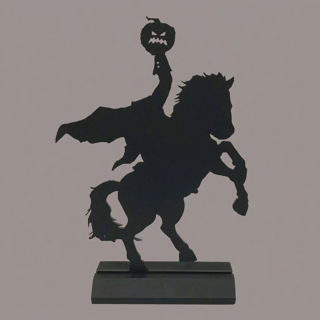 Black silhouette of a person riding a horse with a menacing face on a white background