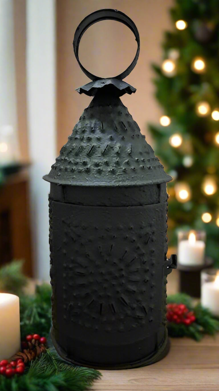 A textured black metal lantern designed for a tealight candle holder.
