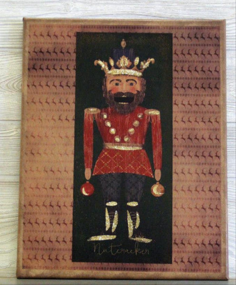 Canvas print with an illustration of a nutcracker with a crown surrounded by rows of prancing reindeer