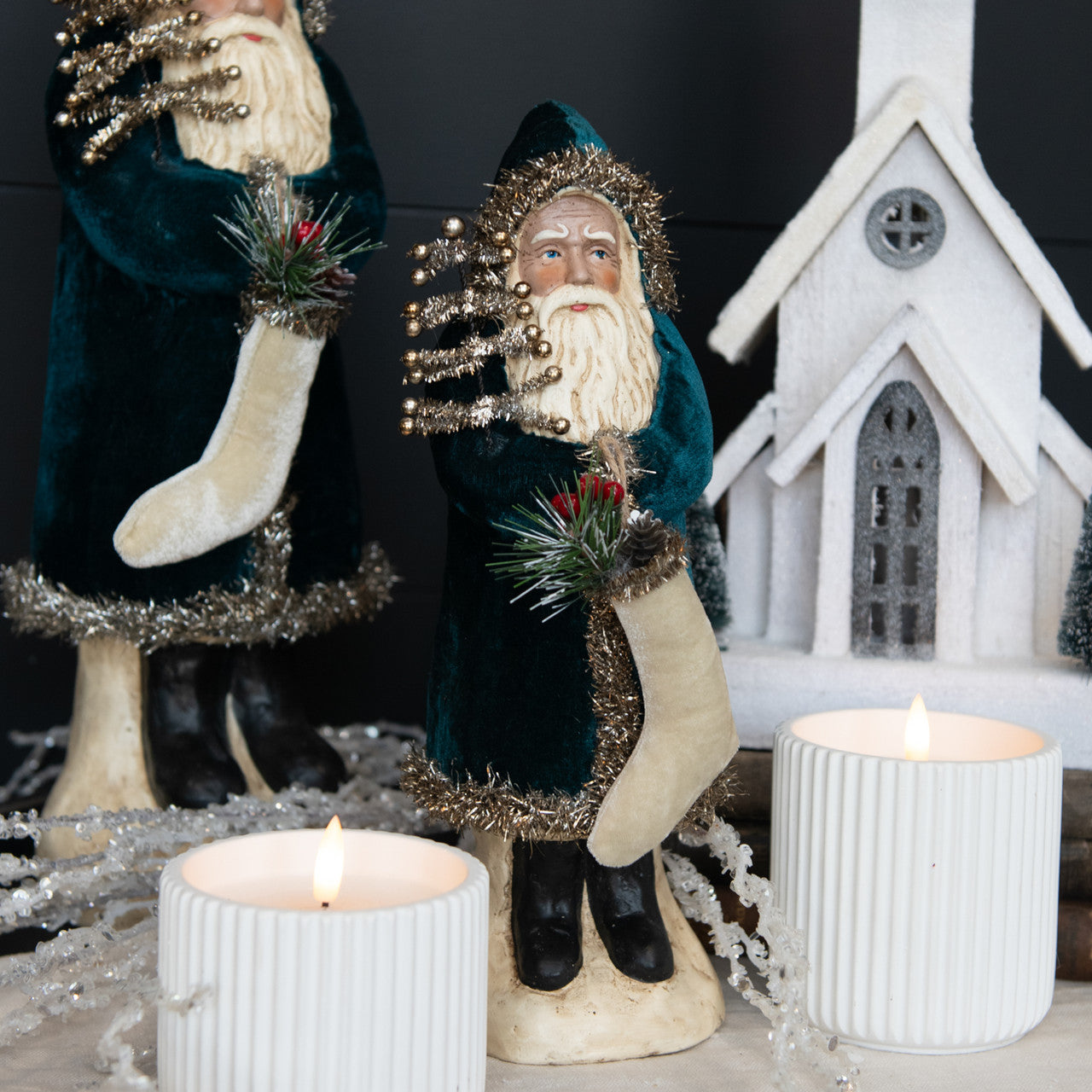 Deep ocean velvet belsnickel with candles and church in background.