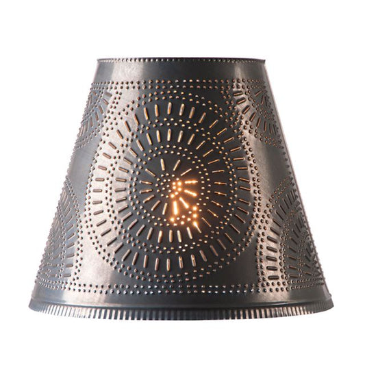 A 14-inch black lamp shade with a geometric pattern of punch holes and a visible spider shade fitting for a harp and finial.