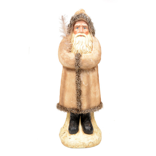 A 16 inch ivory velvet belsnickle figurine with a beard and mustache, wearing a brown coat and black boots, standing on a round base.