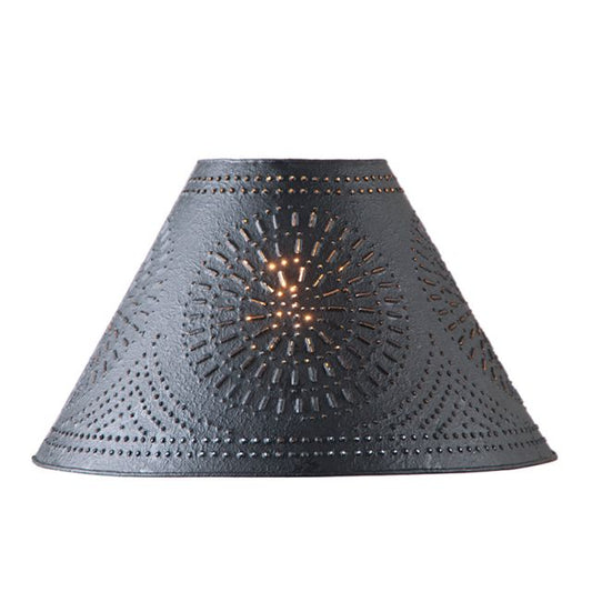A conical black lampshade with a hand-punched chisel design