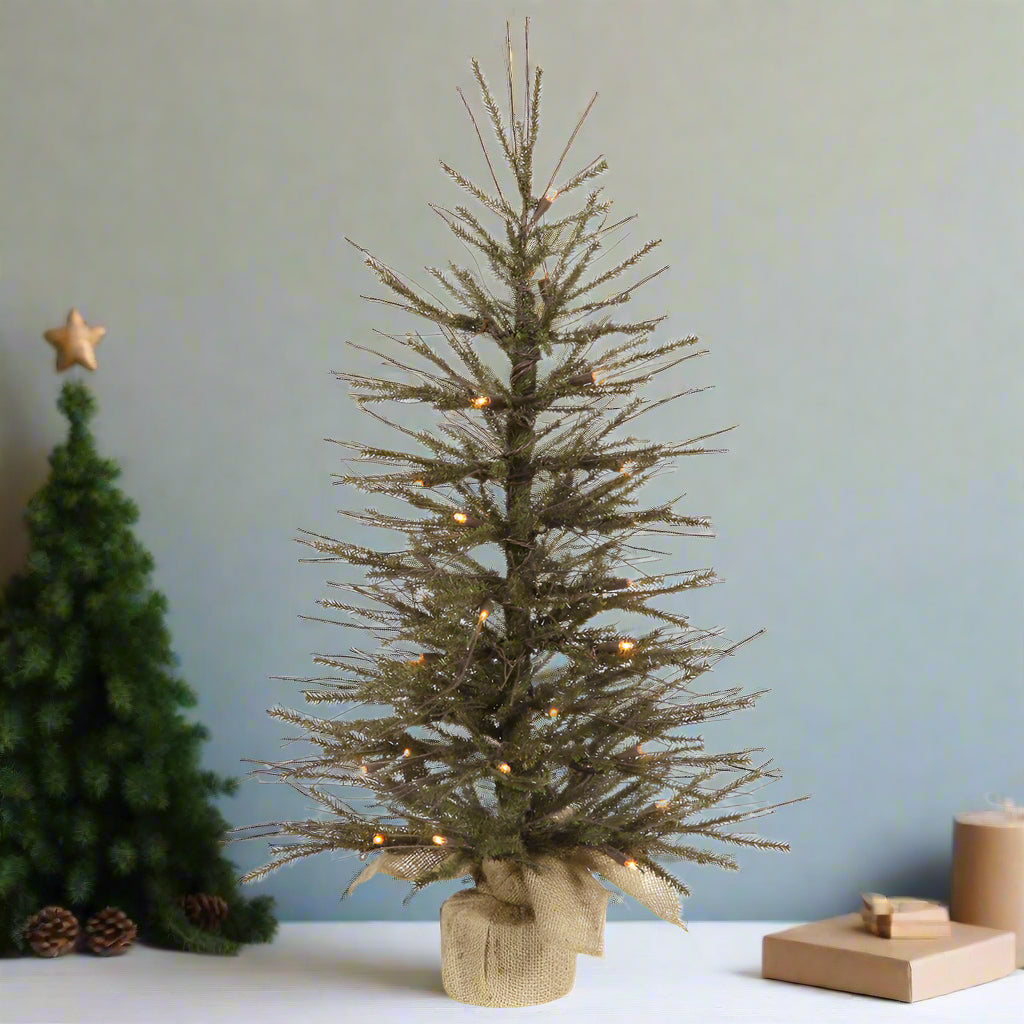 An artificial 18-inch Vienna twig tree with realistic twig branches, standing on a wooden base, unlit.