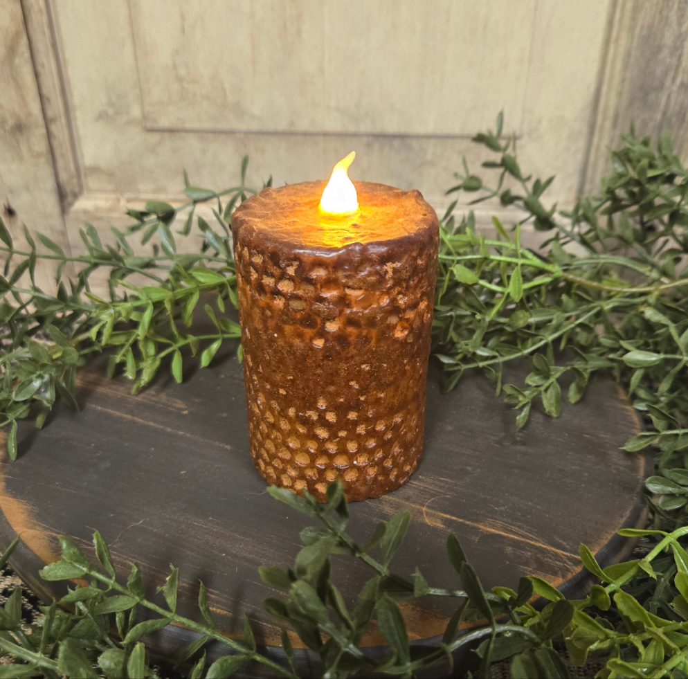 Brown honeycomb pillar that runs on batteries and has a timer feature.