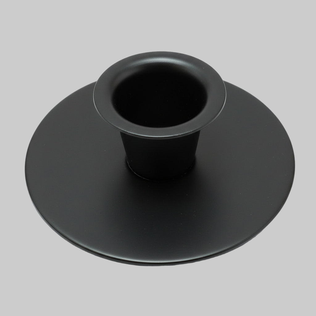 Candle cup sitting on textured surface