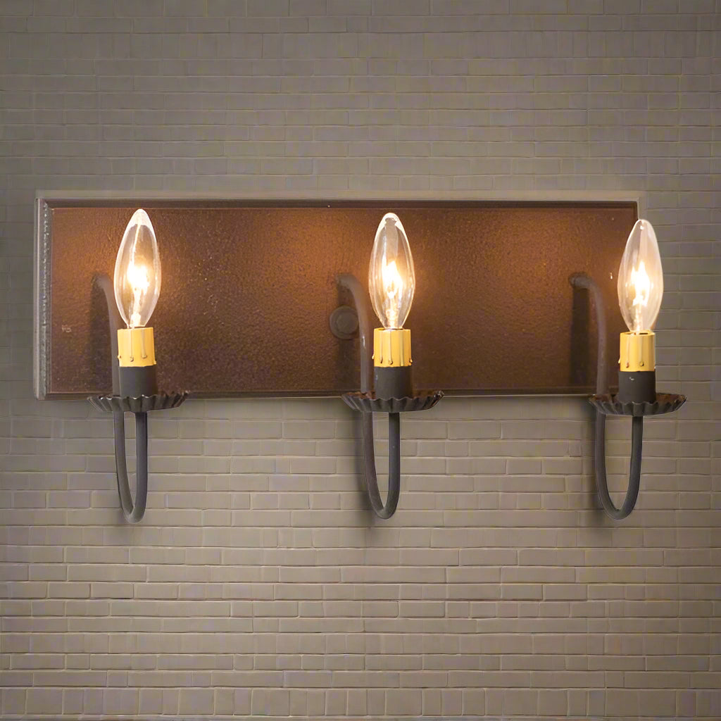 A black textured vanity light with three E12/Candelabra sockets, featuring a classic country design.