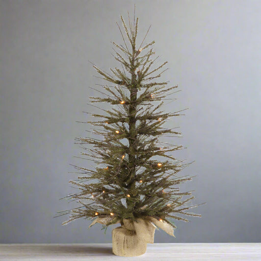 An artificial tree with twigs and lights