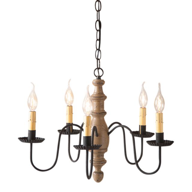 A midsized chandelier with a handspun body in pearwood color, featuring black textured arms and crimped pans, with five E12/Candelabra sockets.