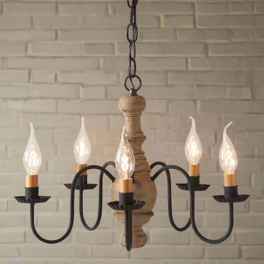 A Lancaster wooden chandelier with textured pearwood finish, black arms with crimped pans, and five E12/Candelabra sockets, featuring a ceiling plate and cord.