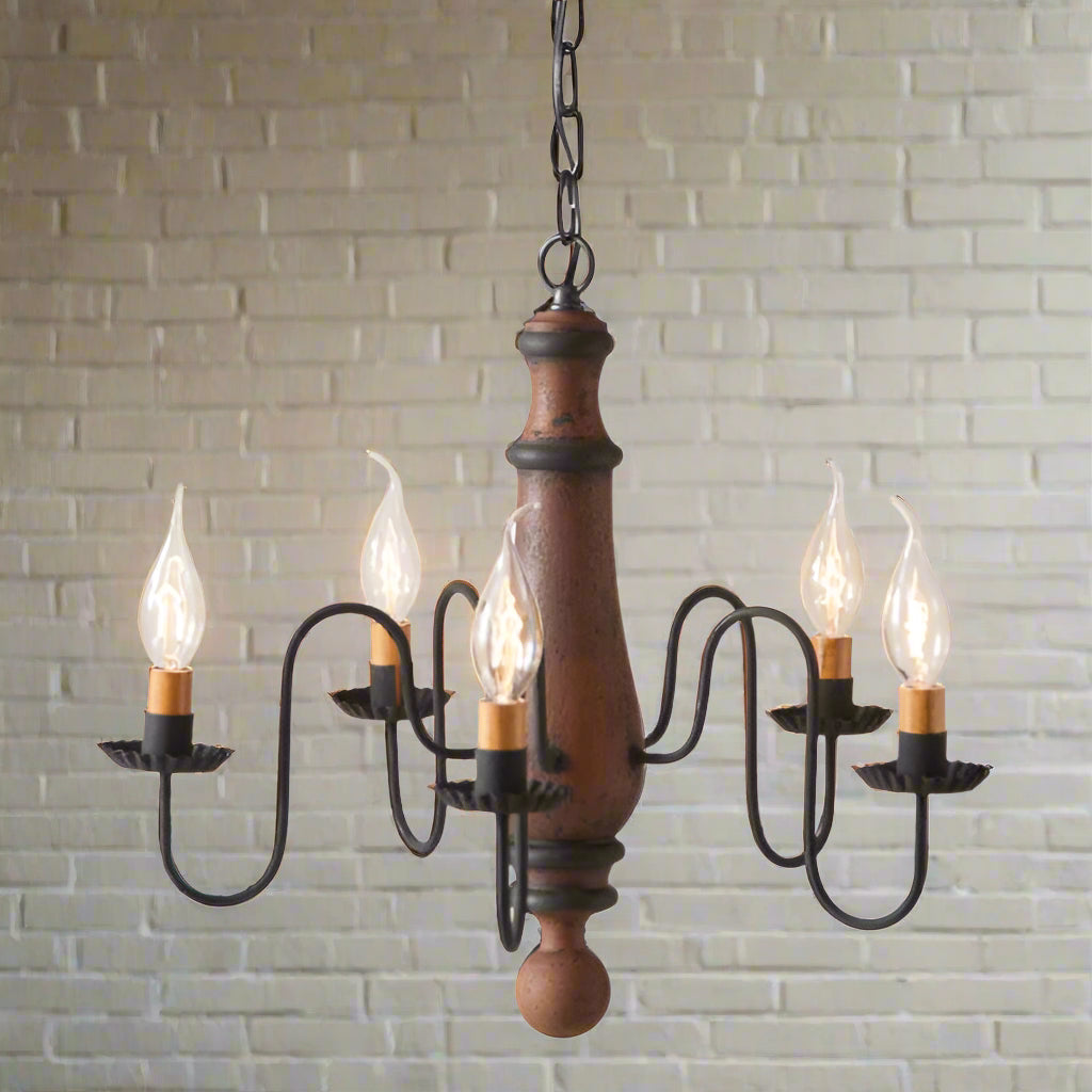 A medium-sized Norfolk wooden chandelier with a Hartford pumpkin design, featuring black textured arms and crimped pans, with E12/Candelabra sockets.