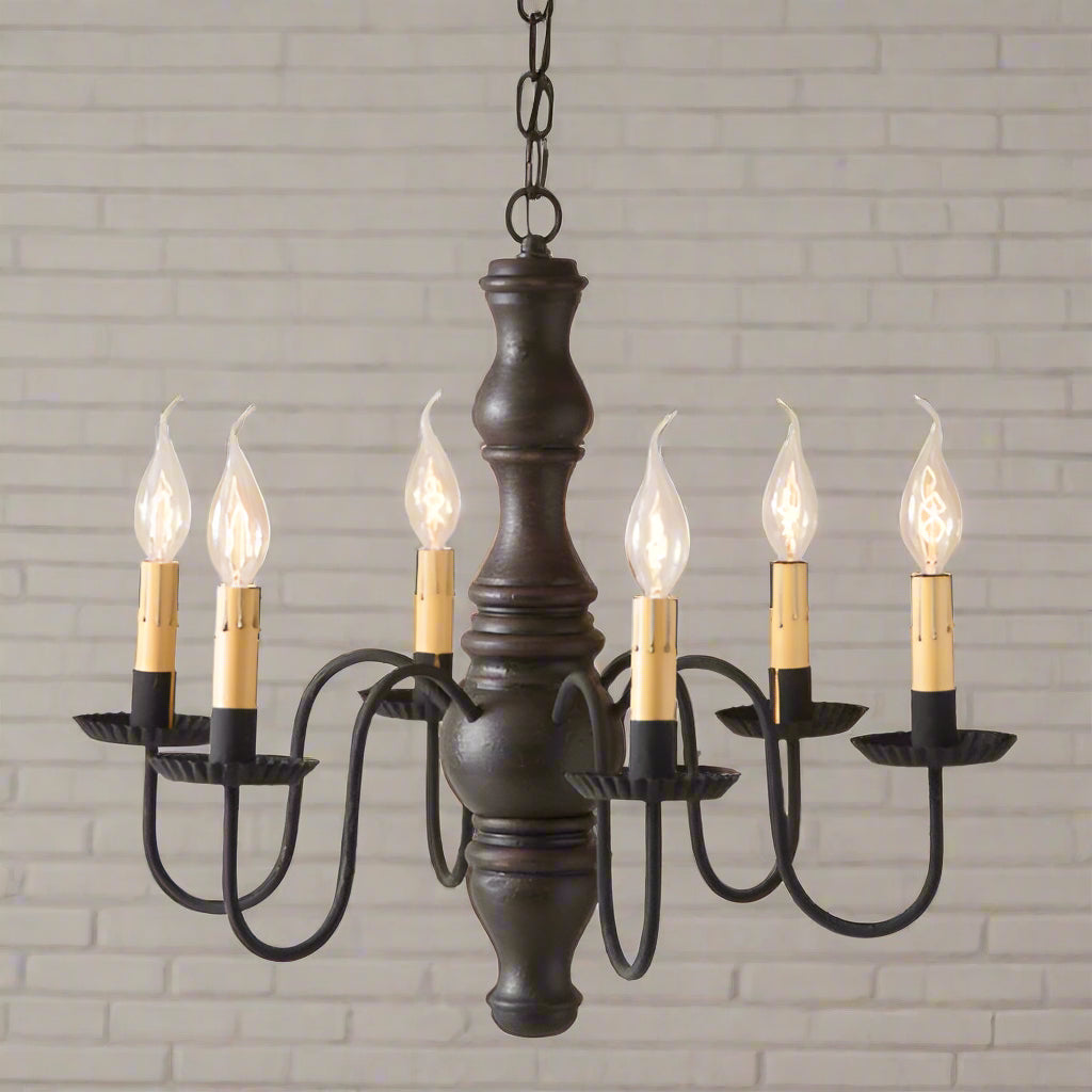A sophisticated, textured black over red finished Gettysburg wooden chandelier with six E12/Candelabra sockets, featuring handcrafted details such as crimped pans and textured arms, suspended from a chain.