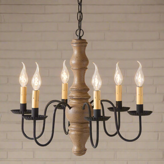 A Gettysburg wooden chandelier with a pearwood finish, black textured arms, and six candle-style lights.