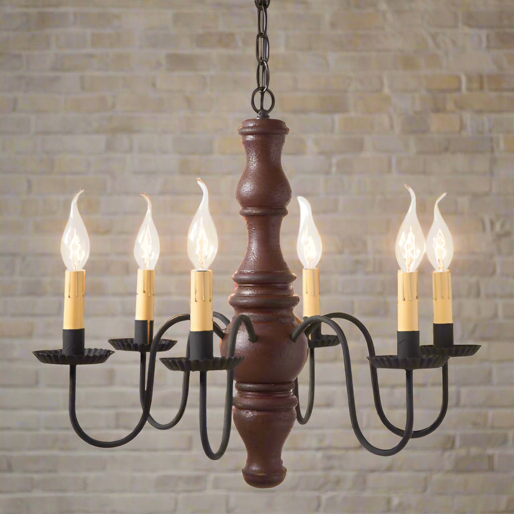 A Gettysburg wooden chandelier with a textured Plantation Red finish, black arms, and crimped pans. It features six E12/Candelabra sockets and is hung from a chain.