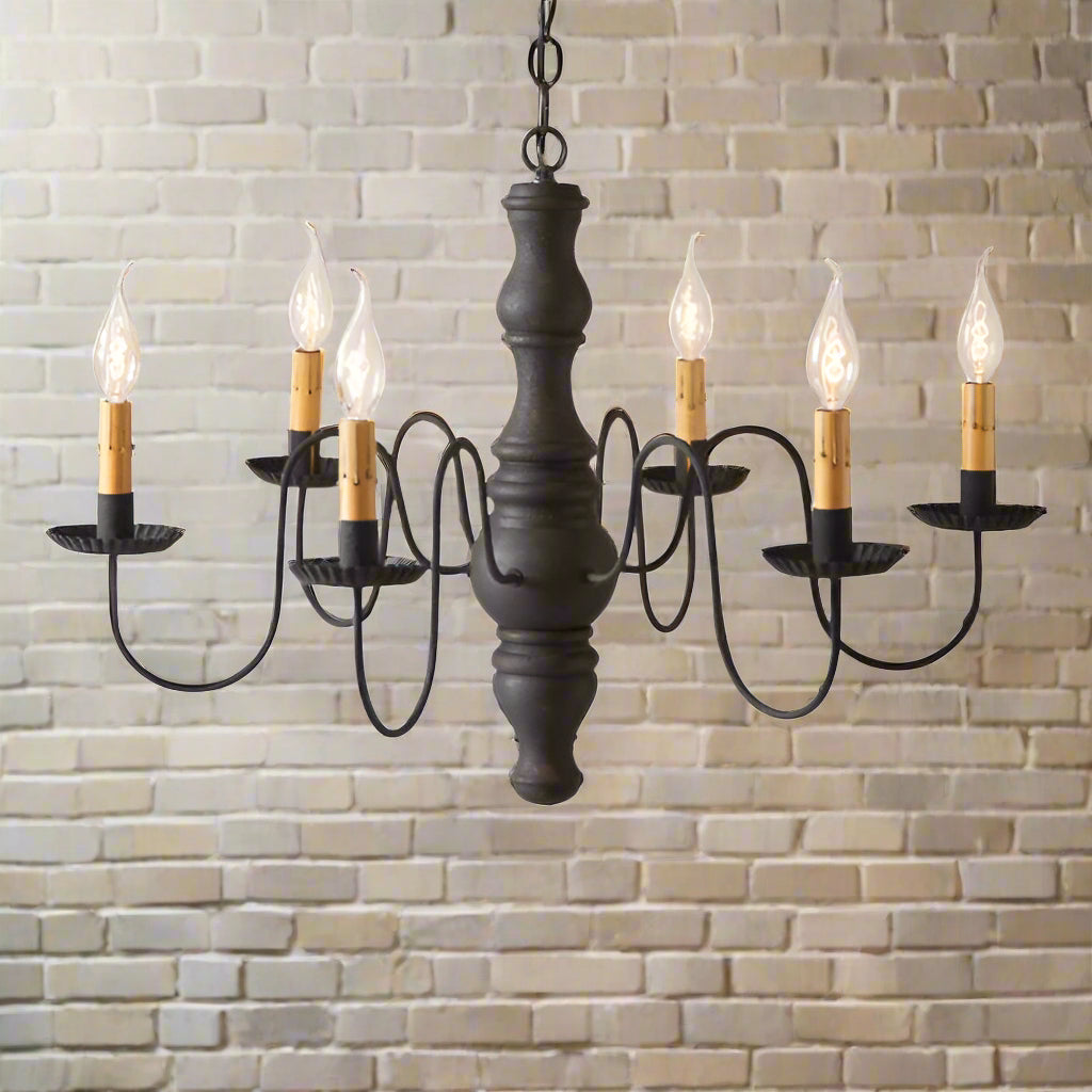 A wooden chandelier with a black textured finish and crimped pans, featuring six hanging lights.
