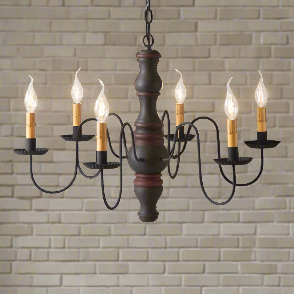 Six arm primitive chandelier with six candelabra sockets in a black with red stripe paint finish on white background.