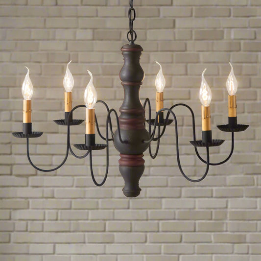 Six arm primitive chandelier with six candelabra sockets in a black with red stripe paint finish on white background.