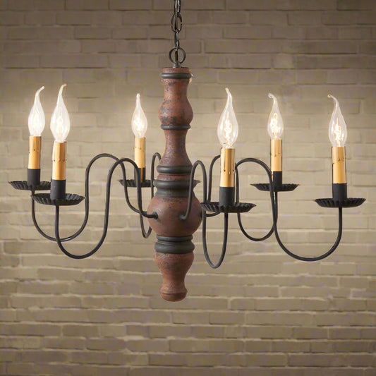 A Gettysburg wooden chandelier with a Hartford pumpkin and black stripe paint finish, featuring black textured arms and crimped pans, with E12/Candelabra sockets.