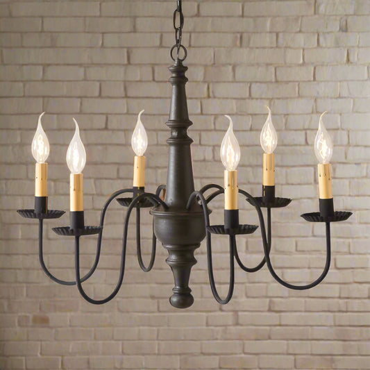 A textured black chandelier with crimped pans on the arms, featuring a red finish and hanging from a chain.