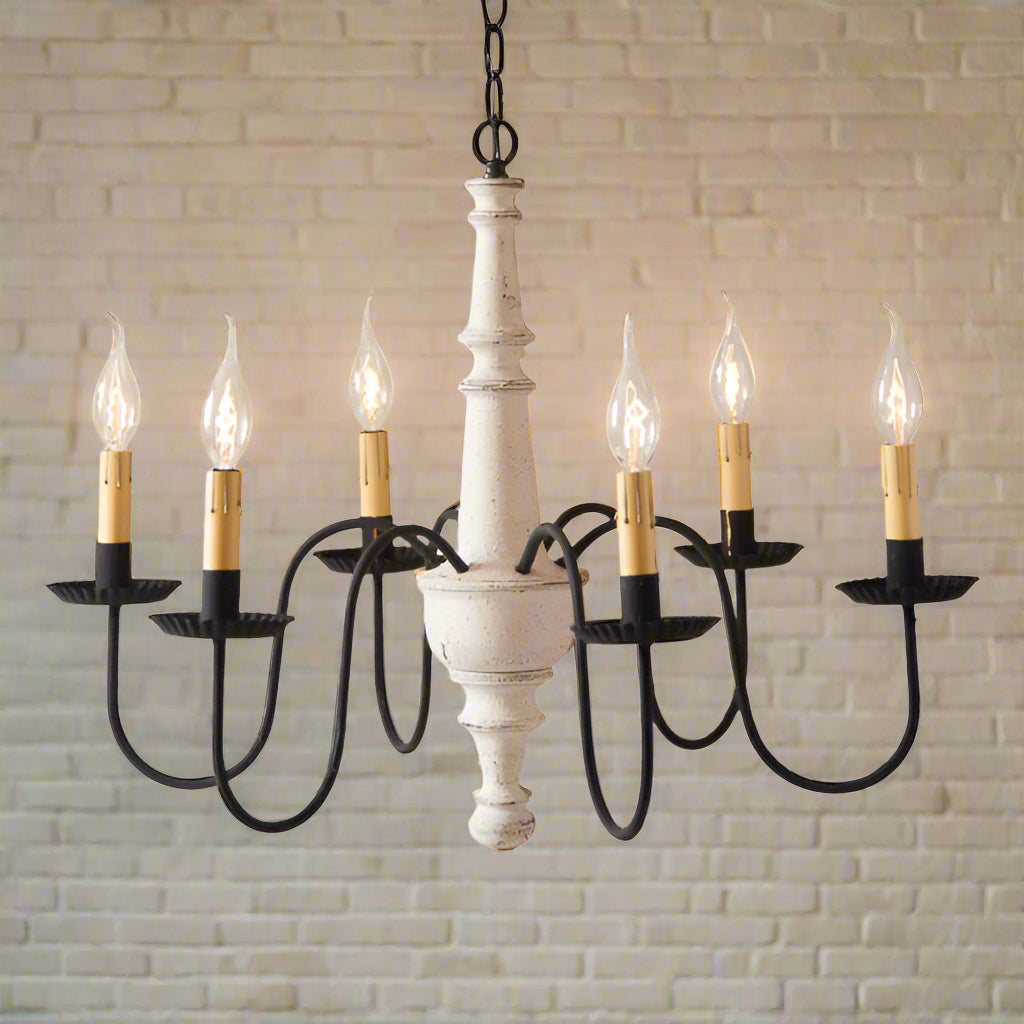 A vintage-style chandelier with a textured white finish and black arms featuring crimped pans. It has six E12/Candelabra sockets and is hung from a chain.