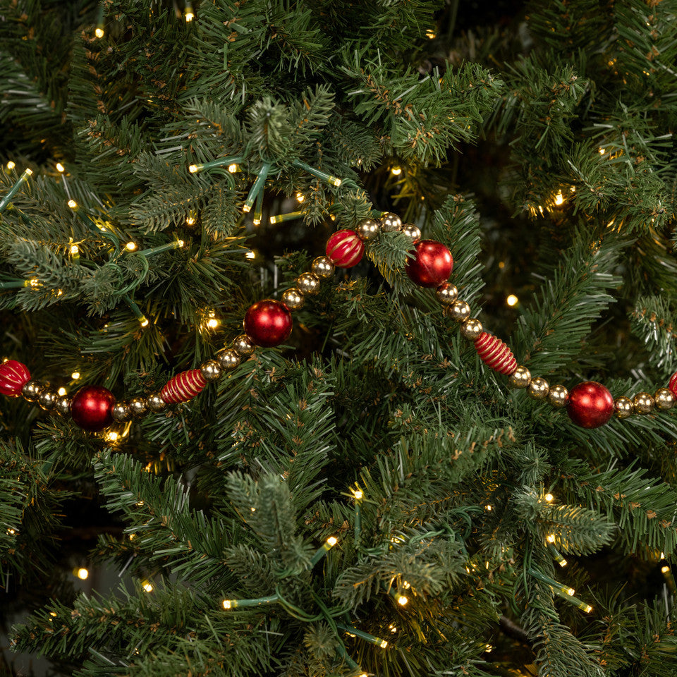 Decorative Christmas tree with red ornaments and string lights