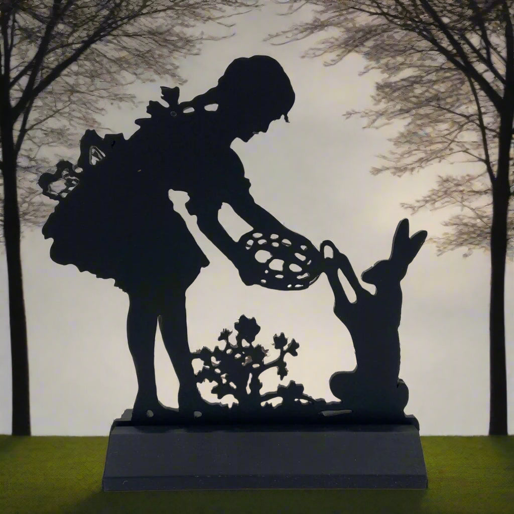 Bunny gathering eggs standing black silhouette on white background