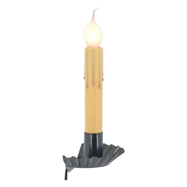 A window sill light that fits between window and sill with a country tin finish, featuring a candle-like appearance with a warm glow.