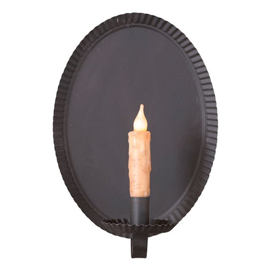 An oval-shaped sconce with a smokey black finish, designed for holding a candle. The sconce appears to be made of metal with a circular frame and a tapered holder at the base.