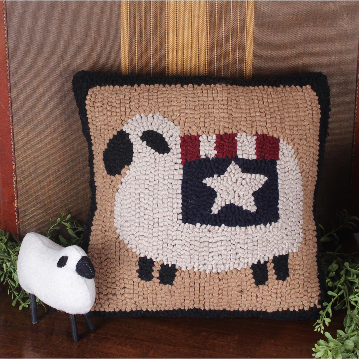 Primitive hooked pillow with Americana sheep