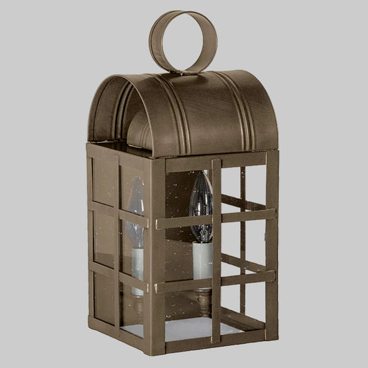 Bronze outdoor wall lantern with glass panels on a white background