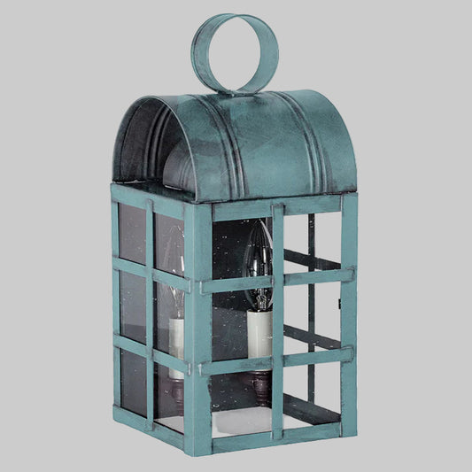 Teal metal lantern with glass panels on a white background
