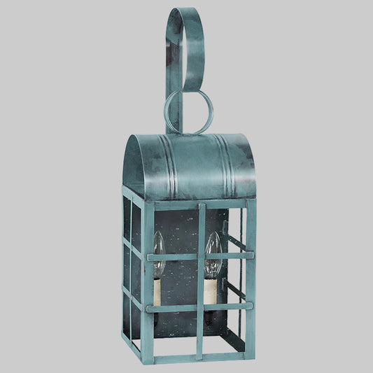 Decorative metal lantern with a handle on a gray background
