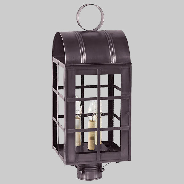 Decorative outdoor lantern with glass panels on a gray background