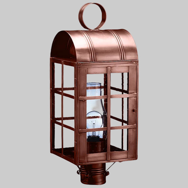 Copper lantern with glass panels on a gray background