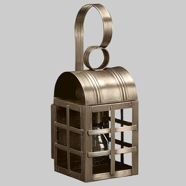 Bronze lantern with a handle on a gray background