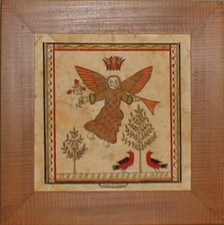 A framed and matted print featuring an angel with a trumpet, trees, and birds in a circular wooden frame.