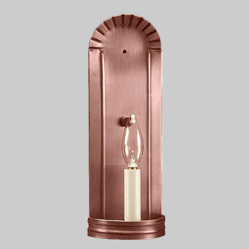 Copper wall sconce with a light bulb on a gray background