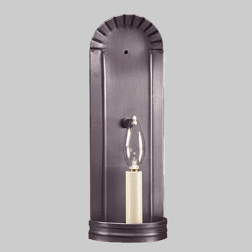 Wall-mounted light fixture with a metallic finish on a gray background