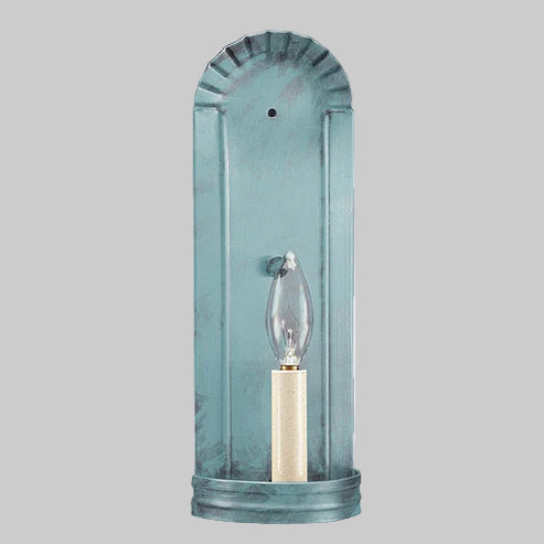 Blue glass wall sconce with a light bulb on a gray background