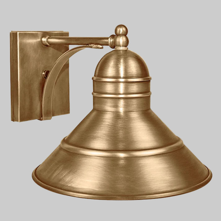 Brass wall sconce on a white background