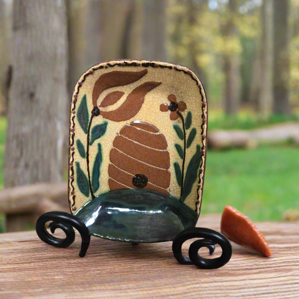 Decorative piece with a natural design on a stand outdoors