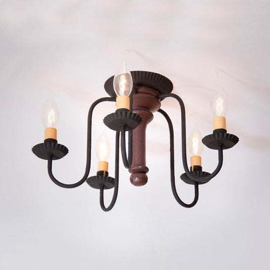 Vintage-style chandelier with five candle-like lights on a plain background