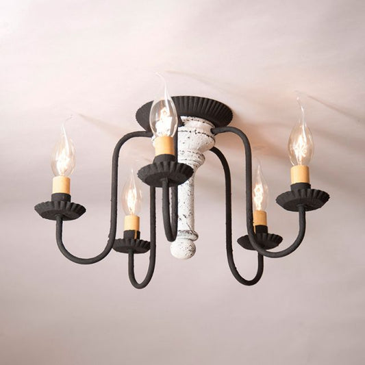 Ceiling light fixture with six candle-style lights on a white ceiling.