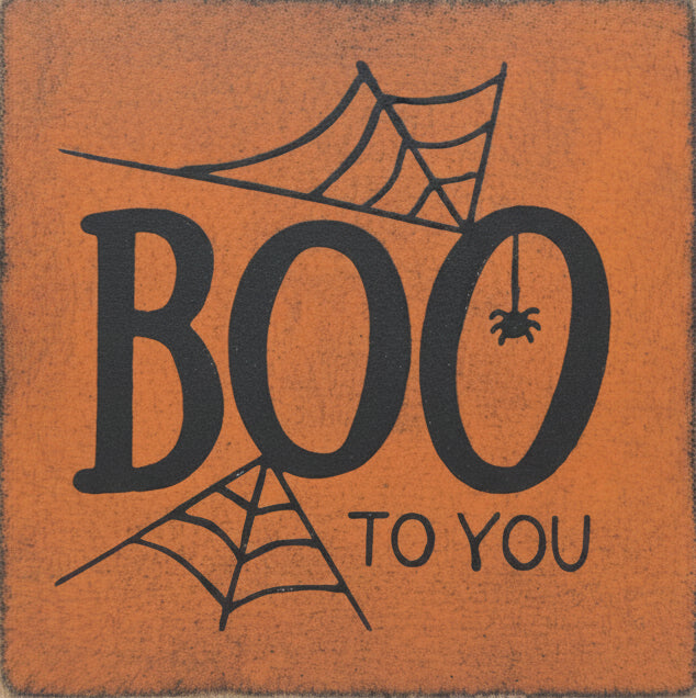 Wood block with lettering "Boo to you" and a spider