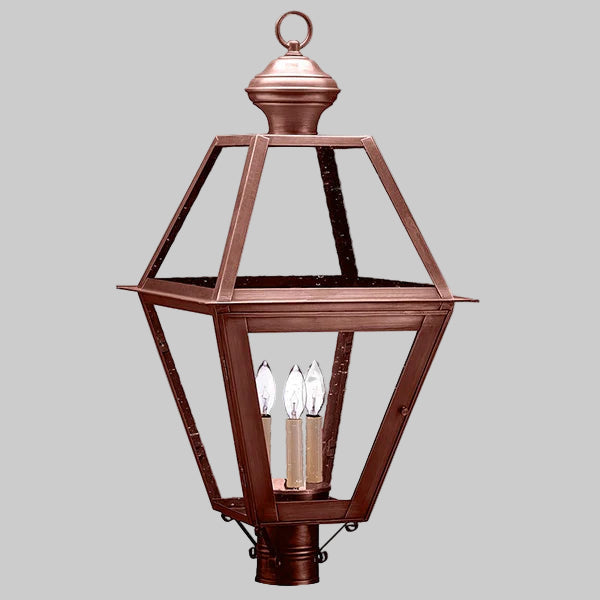 Decorative copper outdoor lantern on a gray background