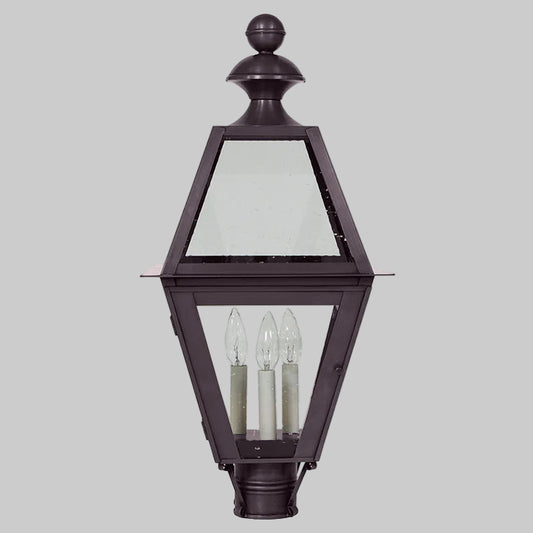 Traditional outdoor lamp with glass panels on a gray background