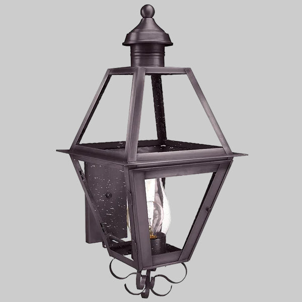 Decorative outdoor lantern with clear glass on a gray background