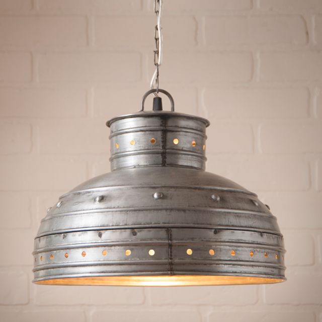 Vintage-style pendant light with a metallic finish on a textured wall background