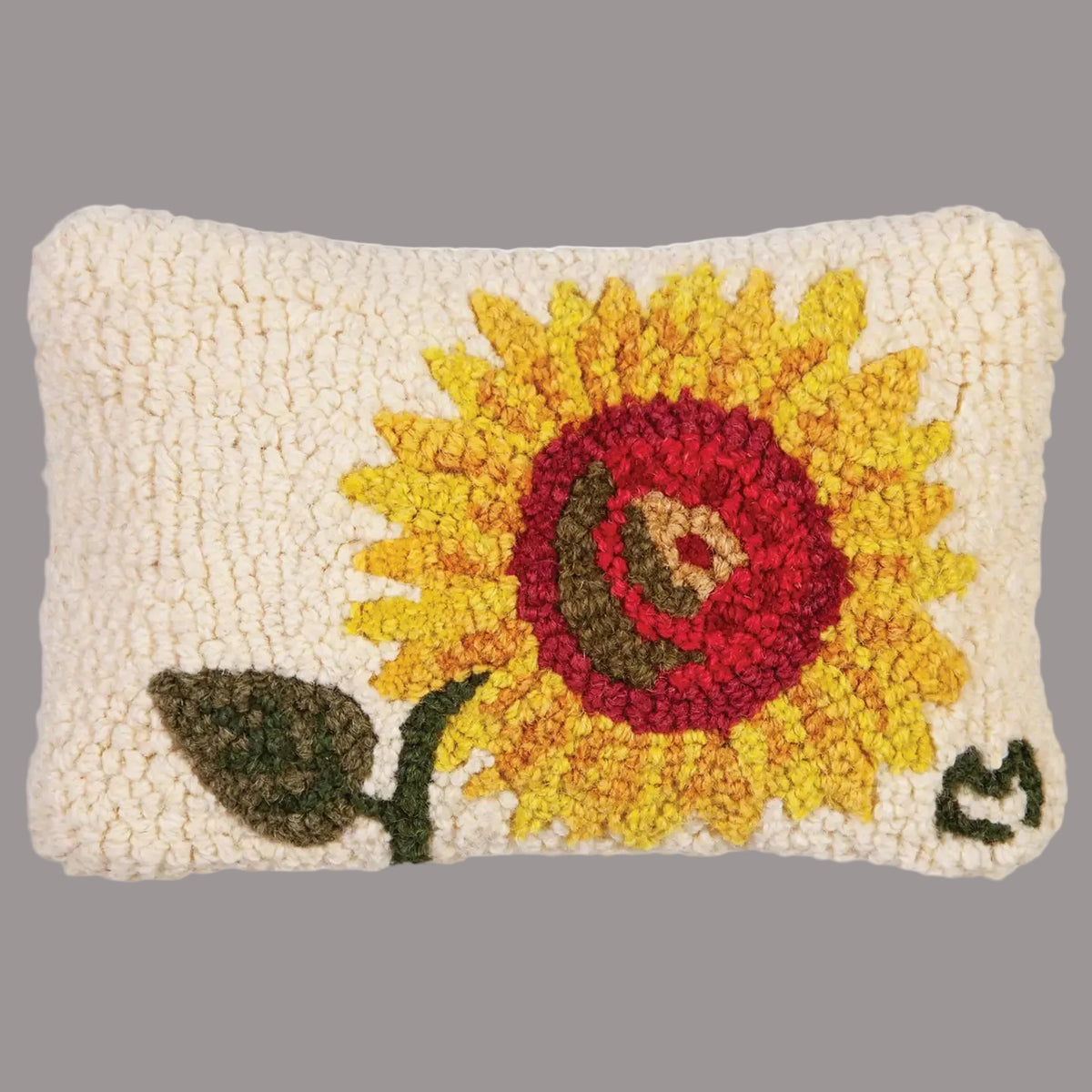 Decorative pillow with a sunflower design on a white background