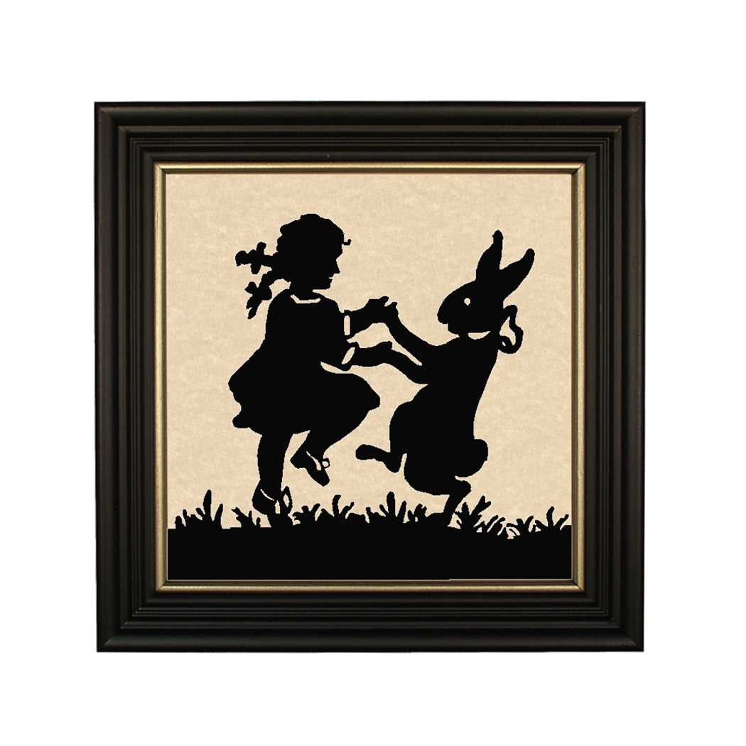 Girl and bunny dancing silhouette in black frame